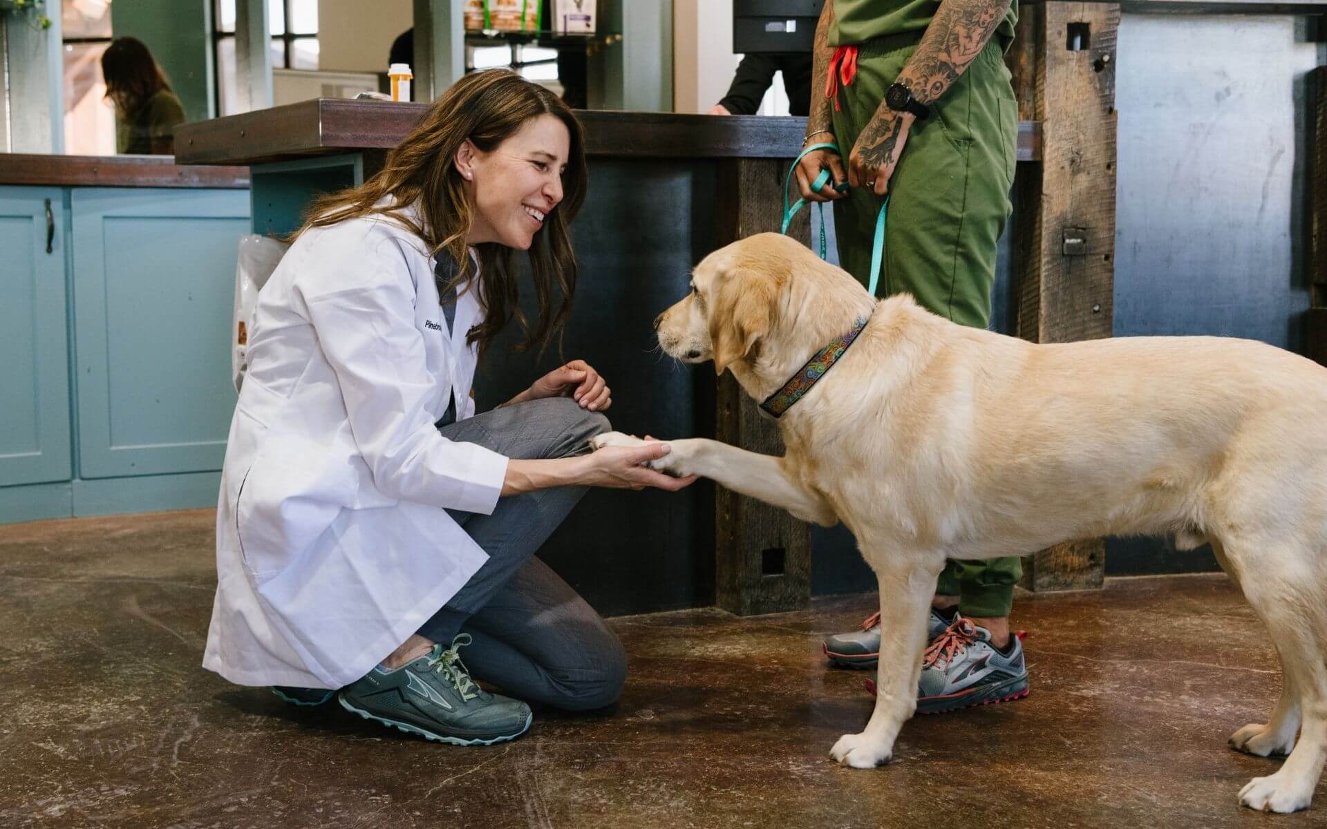 Dr. Jillian Burchett and Larry (Dr. Britt Dubil’s dog) at Pinebrook Animal Hospital in Park City, UT